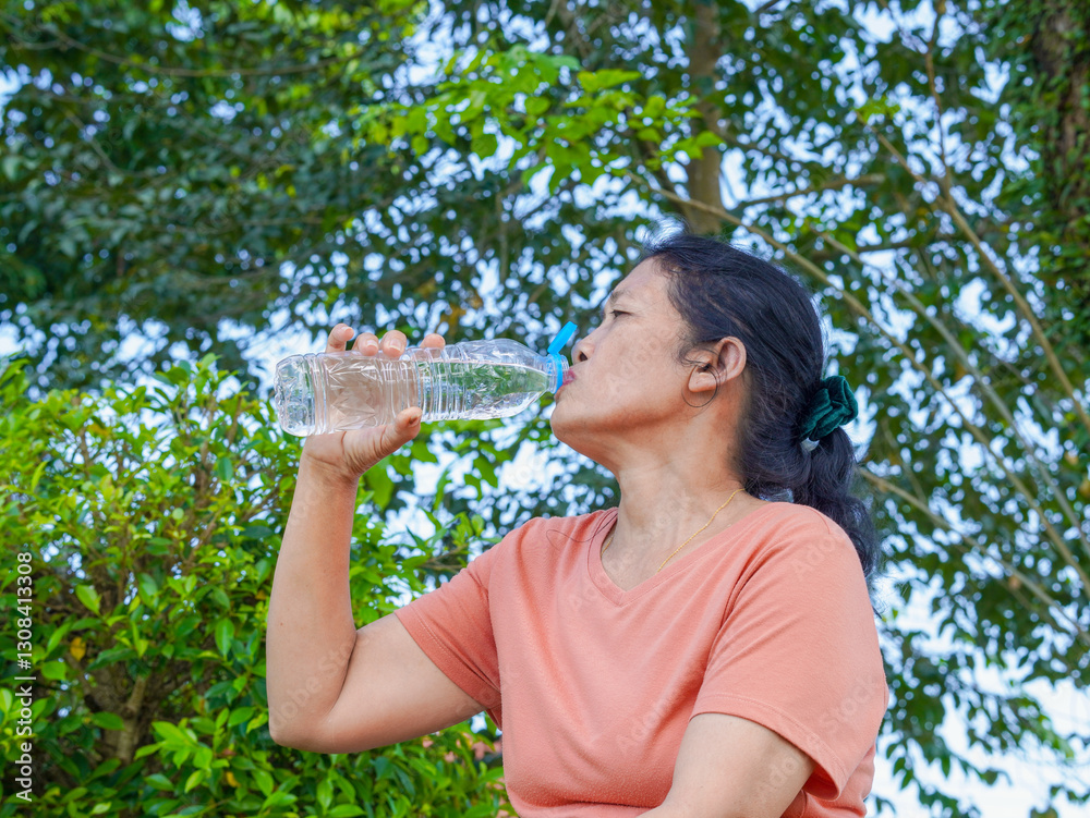 Lifestyle Health care. Senior woman holding water bottle drink. Healthy beverage. People elderly holding water bottles, with natural environment background, fresh refreshing Lifestyle Health care. Senior woman holding water bottle drink. Healthy beverage. People elderly holding water bottles, with natural environment background, fresh refreshing