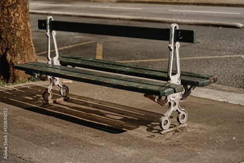 Fototapeta Naklejka Na Ścianę i Meble -  Paris, France - October 2, 2024: A Bench at Daumesnil aveue near Lyon station  in Paris
