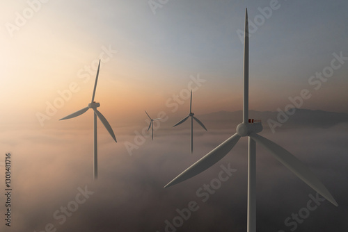 Wind turbine rising above clouds illuminated by sunrise
