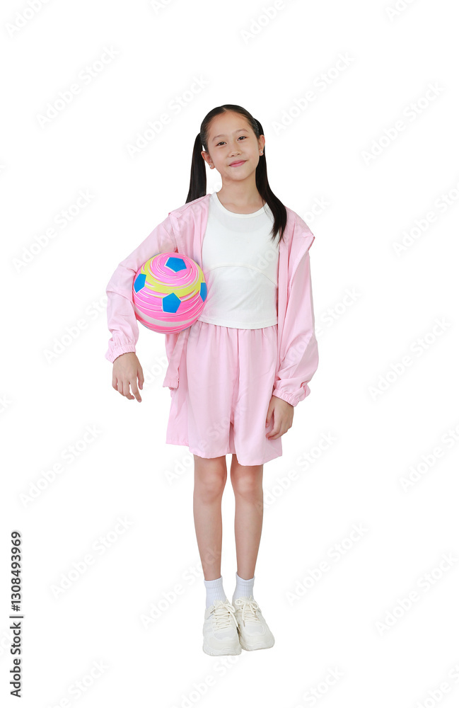 Asian girl child in pink sportswear standing and holding football isolated on white background. Full body photo with clipping path.