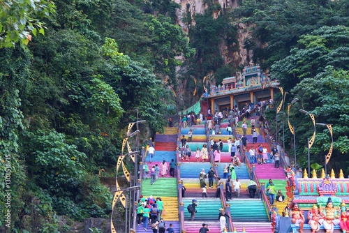 Canvas Print 25 ‎June ‎2024 Kuala Lumpur , Malaysia the Batu Caves' rainbow stairs, showing people ascending towards the cave entrance