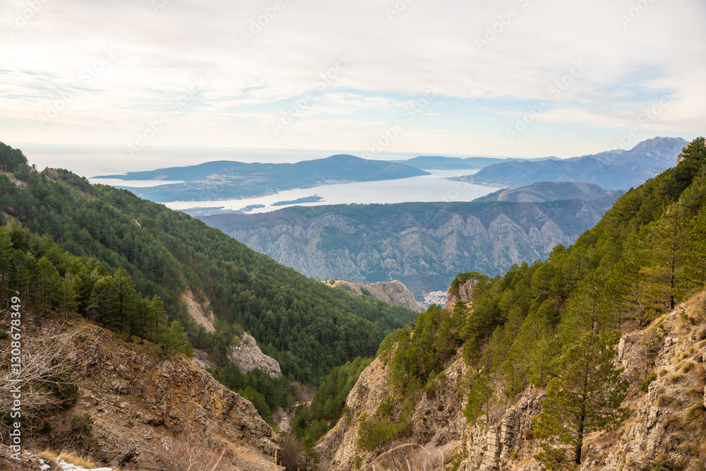 Naklejka premium Panoramic view of Kotor Bay Boca and mountains from mountain view point in Montenegro in winter time