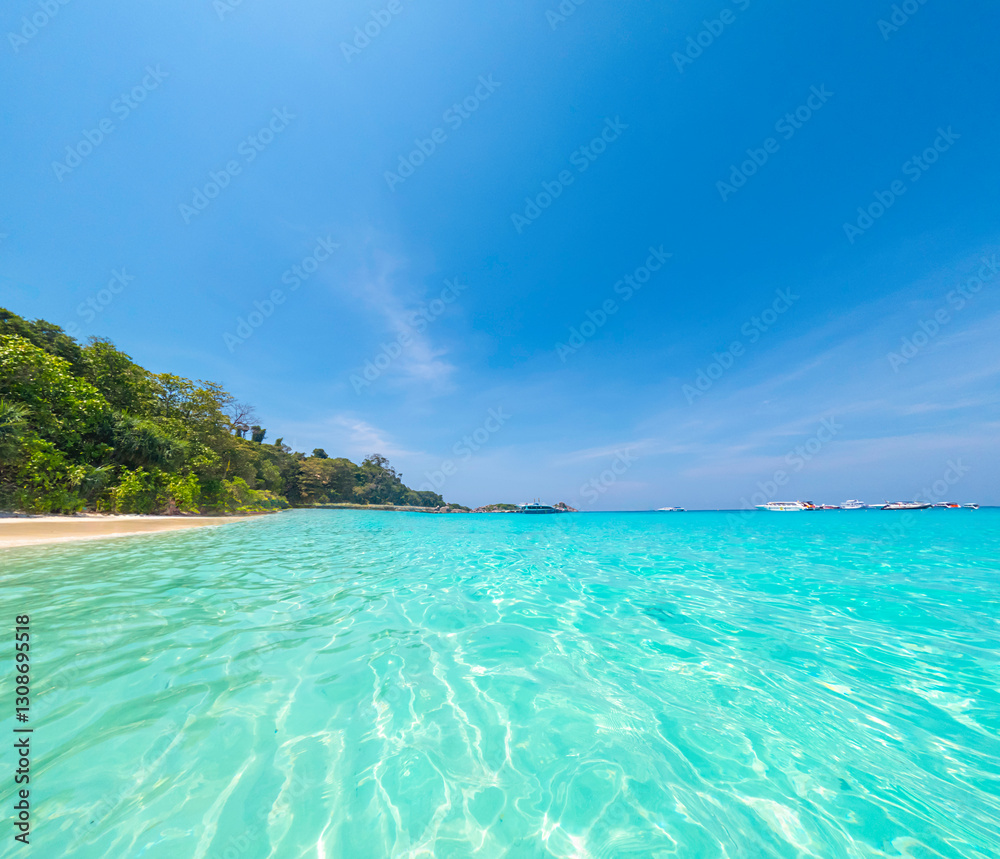Fototapeta premium Sky view, beautiful sea and speedboat, Koh Miang (Island 4) in the Princess Beach area, Similan Islands National Park, Phang Nga Province, Thailand.ds National Park, Phang Nga Province, Thailand.
