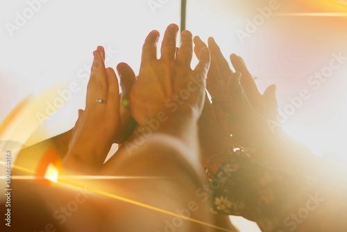 People joining hands in the air
