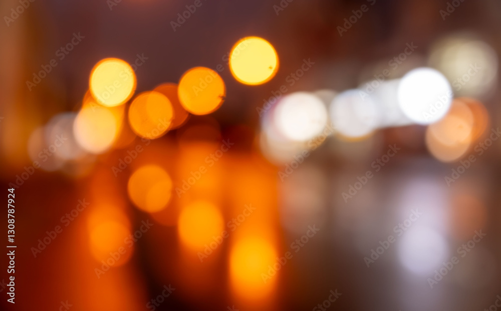 A blurry image of a city street with lights and reflections A blurry image of a city street with lights and reflections