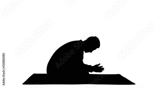 Silhouette of a person praying on a prayer mat