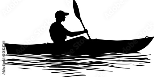 silhouette kayaker paddling water