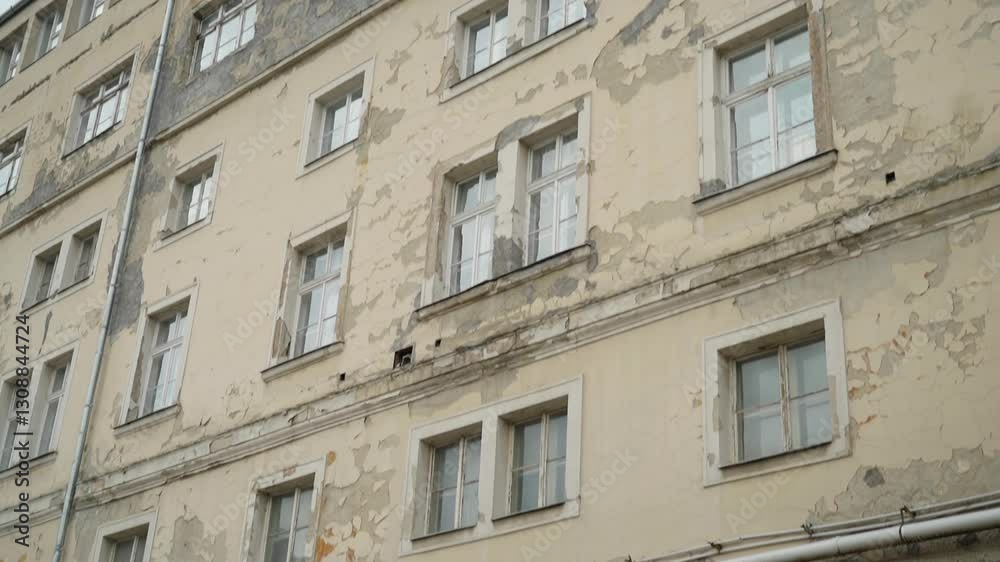 Old building with peeling paint and cracked walls Old building with peeling paint and cracked walls