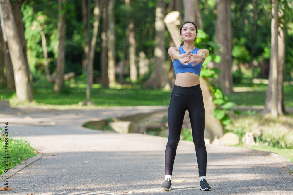 Young asian woman wearing sportswear, stretching her arms in a city park, embracing a healthy lifestyle and promoting wellness while preparing for an invigorating workout Young asian woman wearing sportswear, stretching her arms in a city park, embracing a healthy lifestyle and promoting wellness while preparing for an invigorating workout