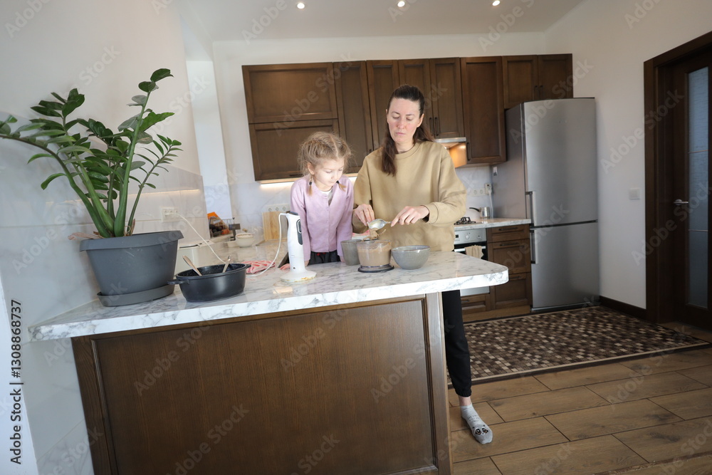 Mother and a daughter indoors spending time together Mother and a daughter indoors spending time together