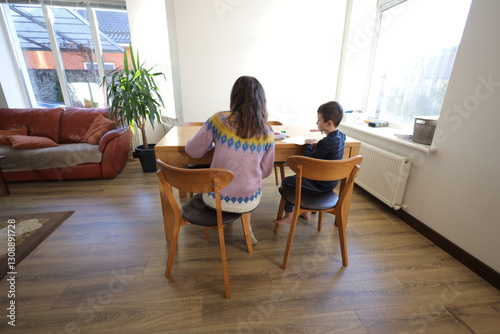 Mother and a child boy playing indoors 