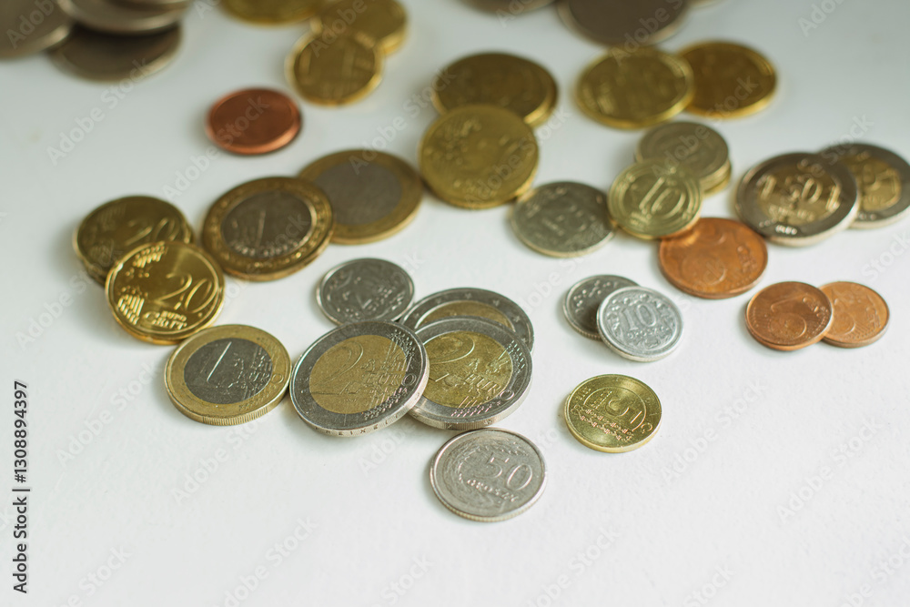 Various european coins with 1 and 2 euros in the front Various european coins with 1 and 2 euros in the front