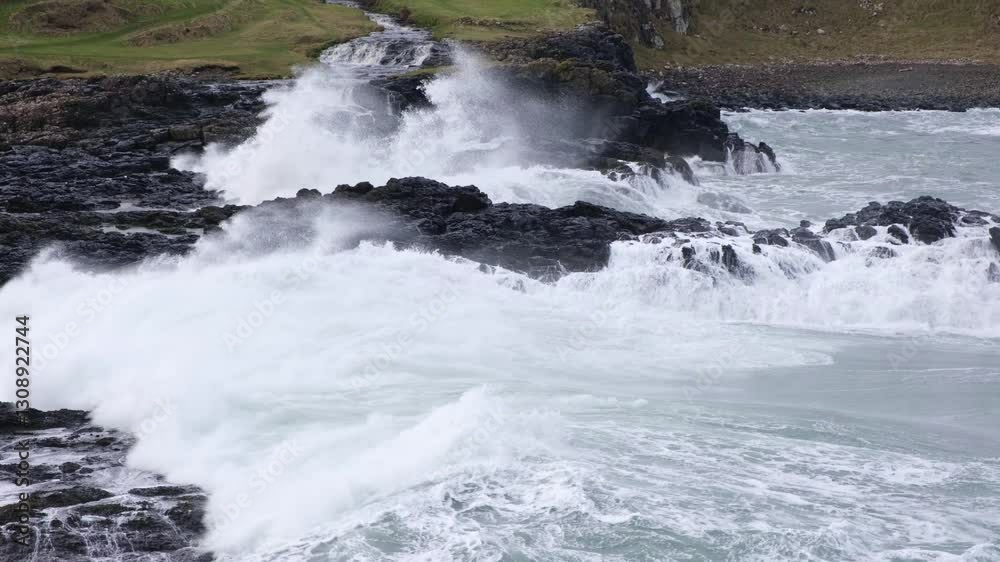 Stormy seas overlooking Dunseverick falls with massive forceful dramatic white crested waves smashing into the rugged rocky shoreline, on the Causeway Coast of Northern Ireland. Stormy seas overlooking Dunseverick falls with massive forceful dramatic white crested waves smashing into the rugged rocky shoreline, on the Causeway Coast of Northern Ireland.