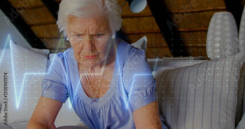 Image of cardiograph over senior caucasian woman at home