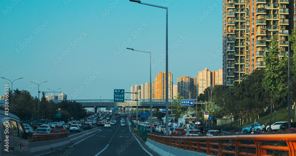 Chengdu, Sichuan, China. Road From Chengdu Tianfu International Airport To Chengdu City. Cars Drive On Highway In China. High-rise Houses Elevated View Cityscape Skyline On Background. Chengdu Is