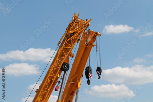 The Jibs of Two Heavy Duty Construction Cranes. photo