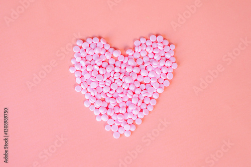 Depilatory wax of pink color, depilatory spatulas, hot wax type, for face and body, pink granules on a pink background