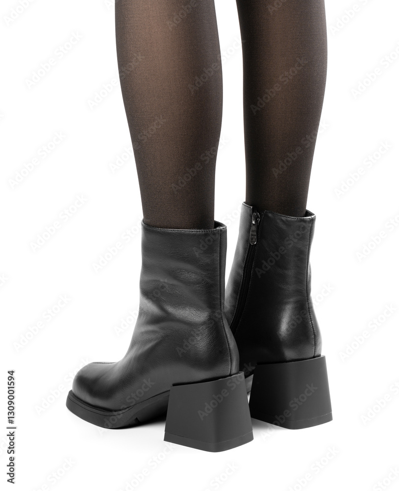 Women's shoes on a white background. Close up of a women's black leather chelsea boots on white background. Footwear for city, urban lifestyle or traveling. Concept of fashion, design and footwear. Women's shoes on a white background. Close up of a women's black leather chelsea boots on white background. Footwear for city, urban lifestyle or traveling. Concept of fashion, design and footwear.