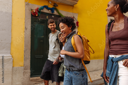 Tourists walking and laughing in lisbon, portugal