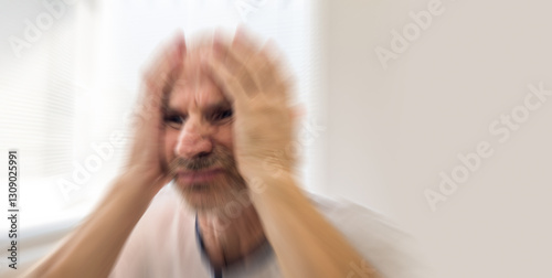 Mentally sick senior is having seizure of the anxiety. Blurry mental health concept.