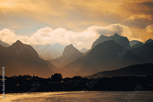 A breathtaking mountain landscape captured at dusk with a beautifully cloudy sky above