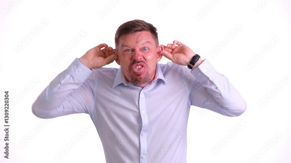 A man visibly showing intense levels of frustration and anger, ideal for themes related to emotional conflict A man visibly showing intense levels of frustration and anger, ideal for themes related to emotional conflict