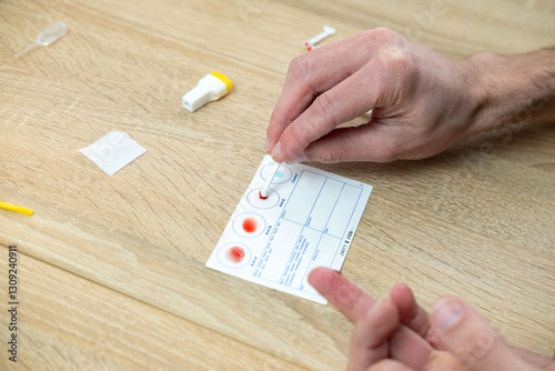 Konstfotografi Blood typing test being performed, showing results on card, focusing on health a