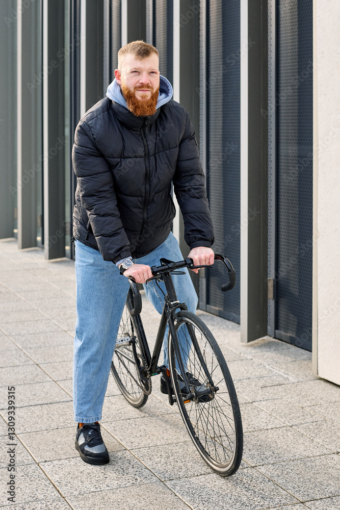 A man in an autumn jacket took a bicycle to get around the city A man in an autumn jacket took a bicycle to get around the city