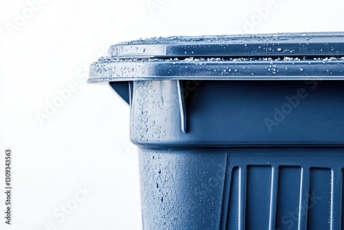 Wet Blue Trash Bin Close-Up with Water Droplets on Surface
