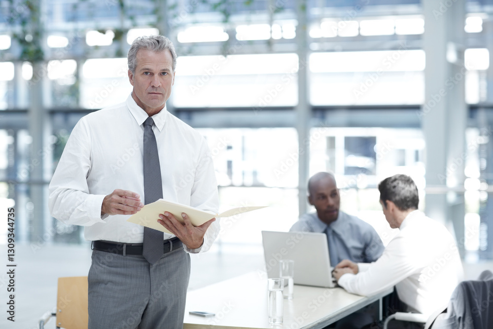 Office, mature and businessman in portrait with file, case documents and legal research at law firm. Meeting, employees and lawyer with policy for corporate justice, ethical obligation and leadership Office, mature and businessman in portrait with file, case documents and legal research at law firm. Meeting, employees and lawyer with policy for corporate justice, ethical obligation and leadership