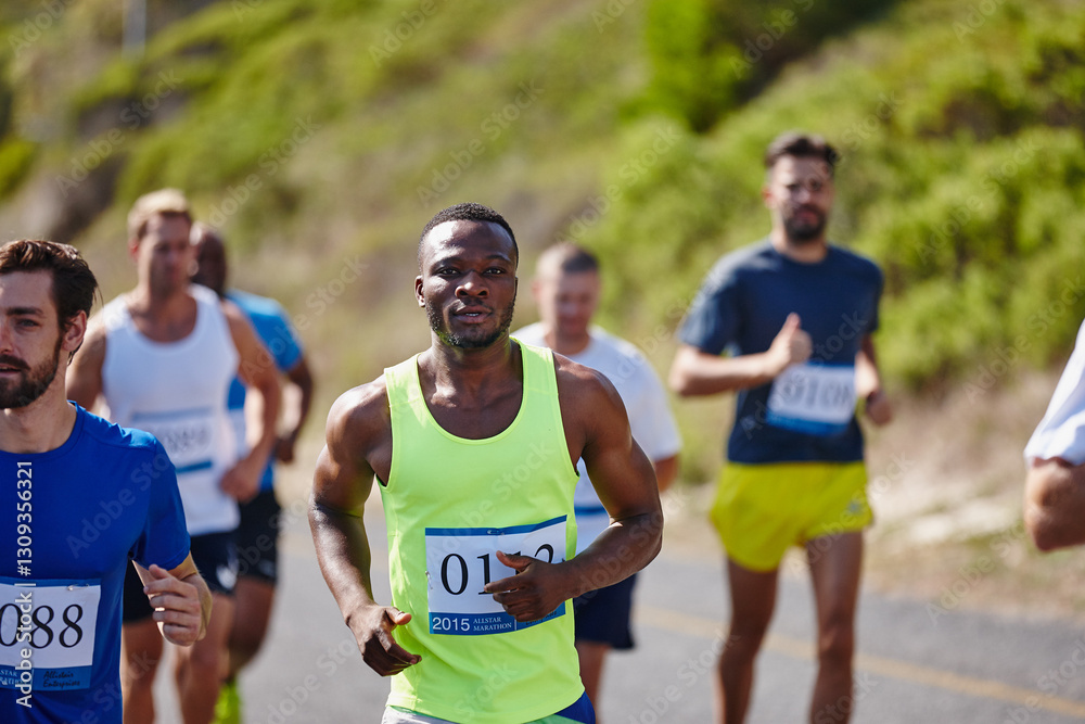 Naklejka premium Athlete, men and running marathon in road for endurance challenge, long distance competition and workout. Sports, runner and group with cardio exercise in nature for fitness pace, contest or wellness