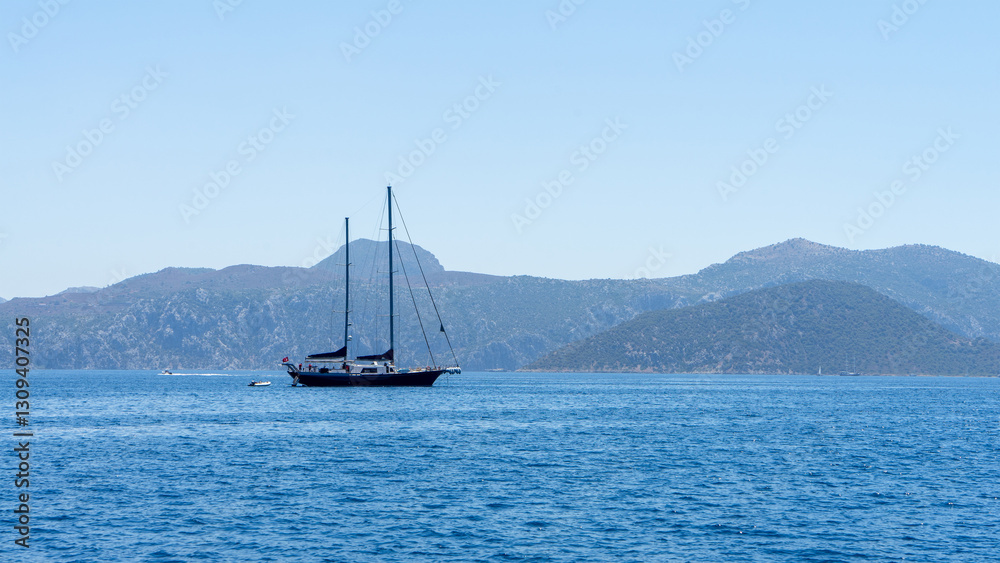 Sailing yacht is sailing along the islands in the Aegean Sea. Trips Sailing yacht is sailing along the islands in the Aegean Sea. Trips
