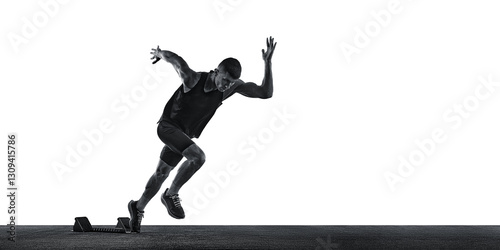 Fototapeta Naklejka Na Ścianę i Meble -  Dynamic photo of young athletic man, sprinter running from start line against white background. Monochrome photo. Concept of sport, healthy lifestyle, championship, action. Ad