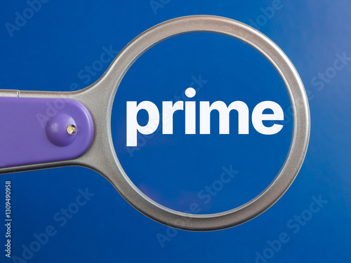 prime text through magnifying glass blue background