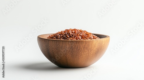 Fresh red rice in wooden bowl on white