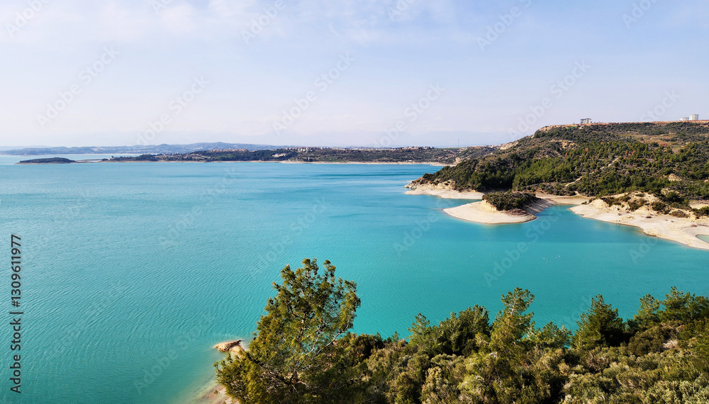 Naklejka premium Seyhan Dam Lake, located north of Adana city, offers a relaxing weekend trip with its unique turquoise appearance