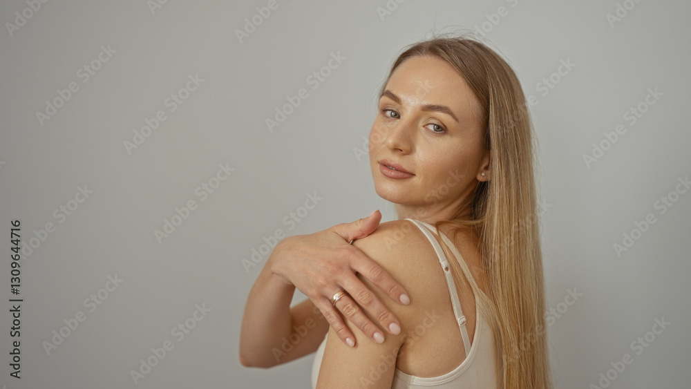 Woman posing isolated against neutral background showcasing beauty elegance charm and sophistication with smooth long blonde hair exuding confidence and poise. Woman posing isolated against neutral background showcasing beauty elegance charm and sophistication with smooth long blonde hair exuding confidence and poise.
