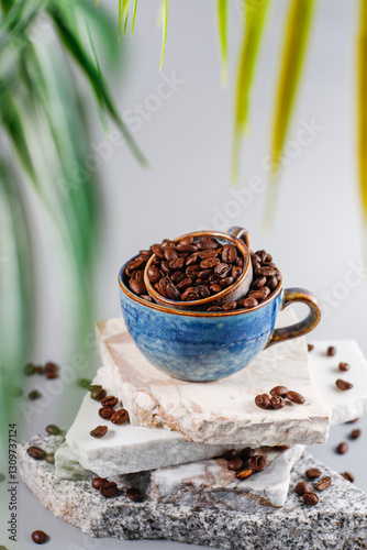 Fresh coffee beans in a mug and background.
