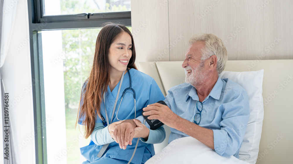 Fototapeta premium Nurse is attentively caring for the senior at the nursing home.