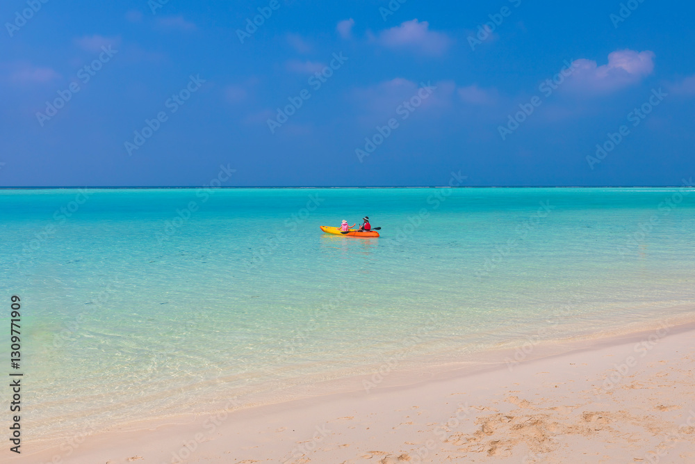 Thoddoo, Maldives - February 05, 2025: Man and child sailing on a boat in the lagoon Thoddoo, Maldives - February 05, 2025: Man and child sailing on a boat in the lagoon