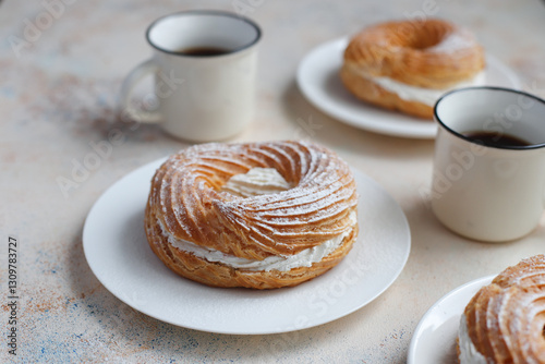Cream puffs with whipped cream and sour cherries.