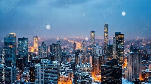 Wallpaper Mural Snowfall blankets Chicago skyline at night with glowing city lights illuminating the winter landscape Torontodigital.ca