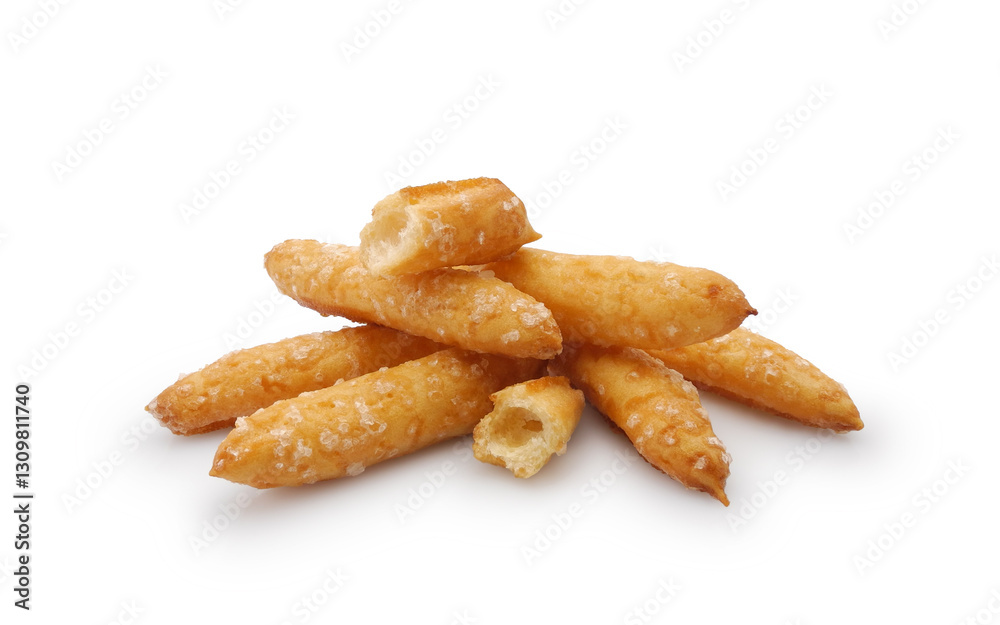 Airy cookies from choux pastry with sugar sprinkles isolated on white background Airy cookies from choux pastry with sugar sprinkles isolated on white background