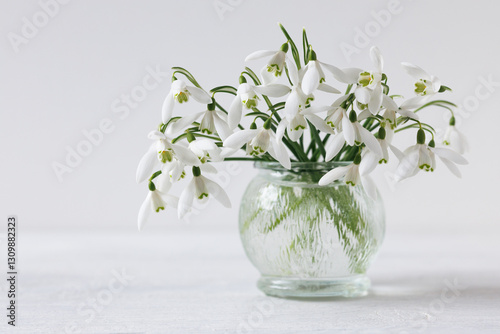 Wallpaper Mural Bouquet of snowdrop flowers in a vase close-up on the table. Beautiful spring postcard Torontodigital.ca