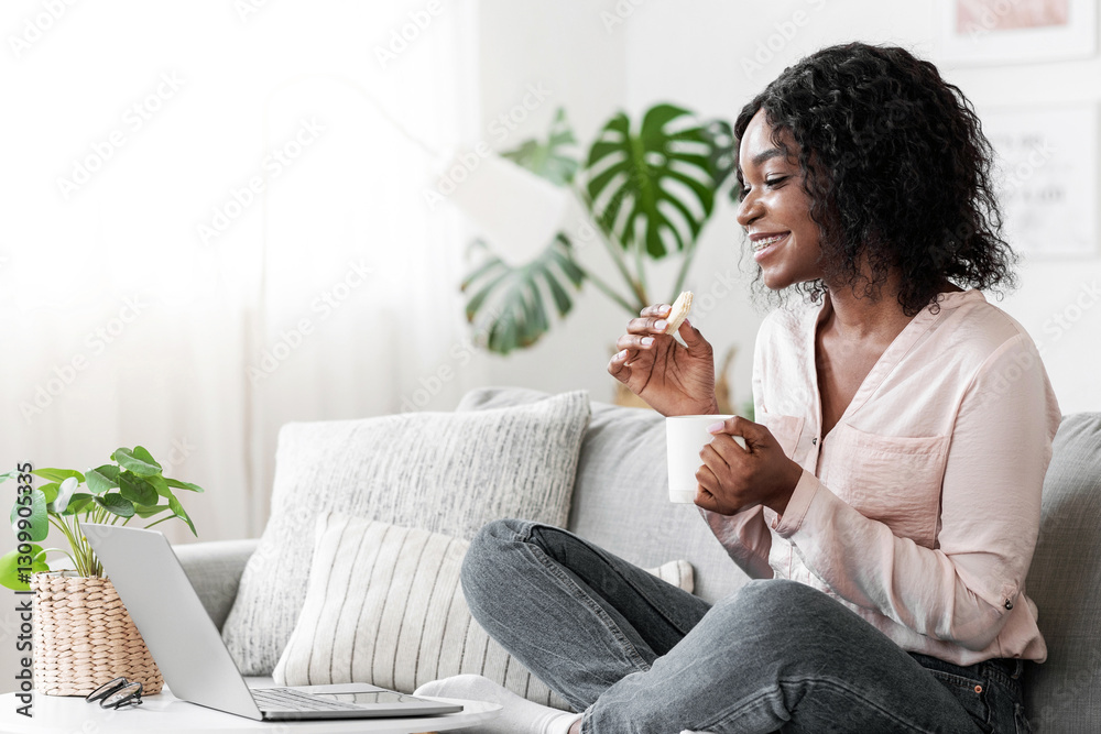 Free Time At Home. Smiling African Woman Relaxing With Coffee And Laptop, Watching Film Online And Eating Tasty Waffles While Resting On Couch In Living Room, Enjoying Domestic Pastime, Copy Space Free Time At Home. Smiling African Woman Relaxing With Coffee And Laptop, Watching Film Online And Eating Tasty Waffles While Resting On Couch In Living Room, Enjoying Domestic Pastime, Copy Space