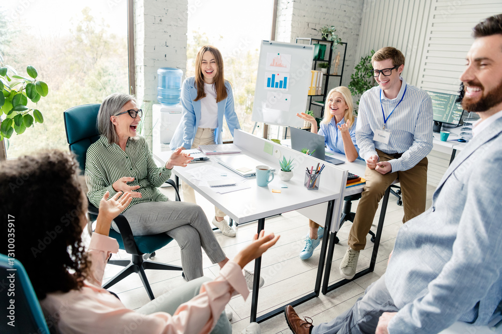 Obraz premium Team of diverse professionals collaborating at modern office workspace