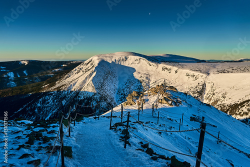 Stunning mountain view at sunrise, snow covered peaks. Amazing hiking place