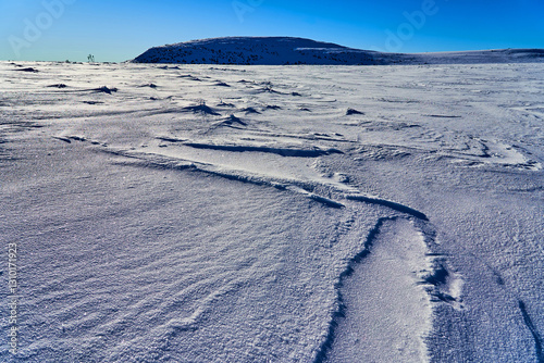 Stunning mountain wilderness landscape, snowy texture. Active vacation