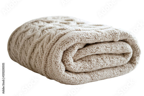 Cozy beige knitted blanket folded neatly on a white surface for home decor or winter warmth