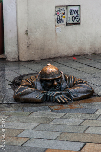 Canvas Print Cumil, the iconic man at work statue peeking from manhole in Bratislava, Slovaki